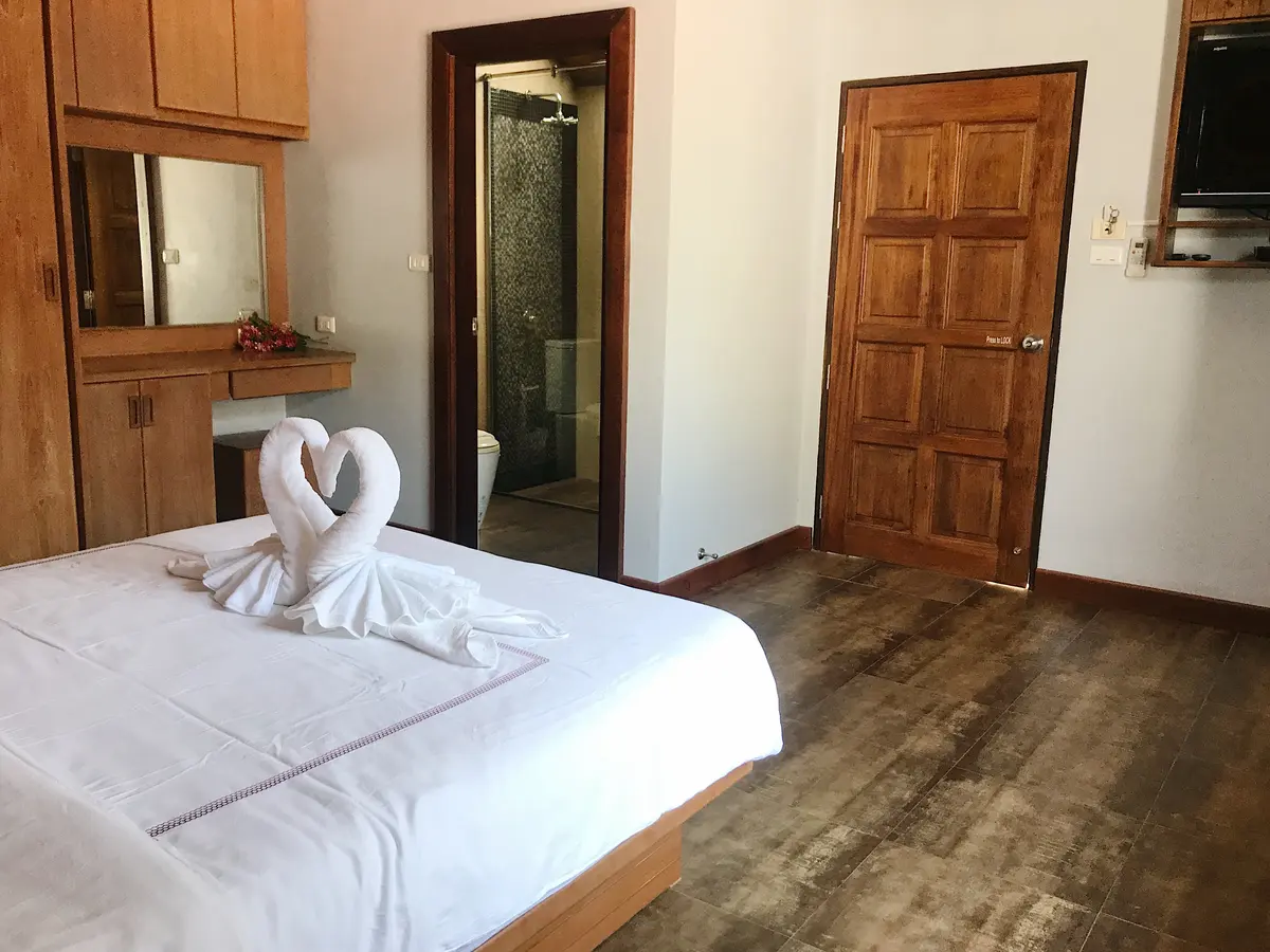 Standard Room bed at The Nest Samui