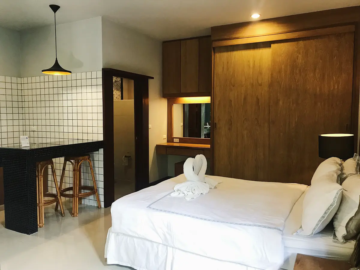 Superior Room bed and sofa area at The Nest Samui